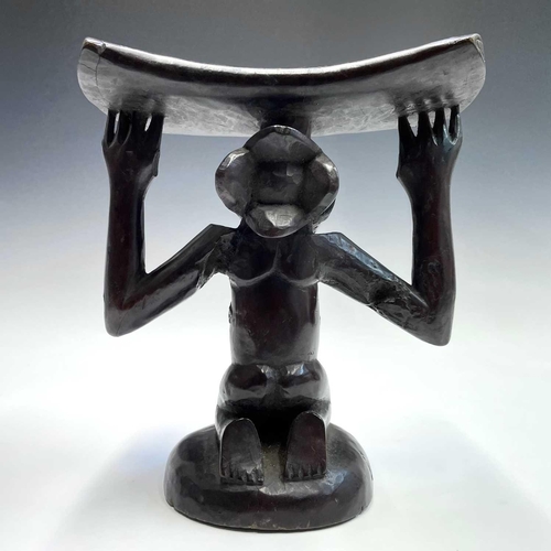 100 - An African Luba, wood carved female caryatid headrest, height 20cm.