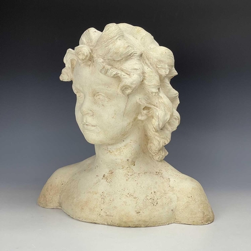 102 - A reconstituted moulded stone bust of a young girl, height 37cm width 36cm depth 16cm.