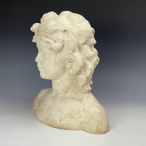 102 - A reconstituted moulded stone bust of a young girl, height 37cm width 36cm depth 16cm.