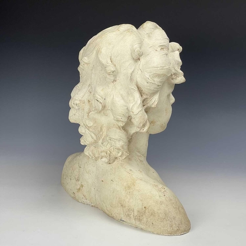 102 - A reconstituted moulded stone bust of a young girl, height 37cm width 36cm depth 16cm.