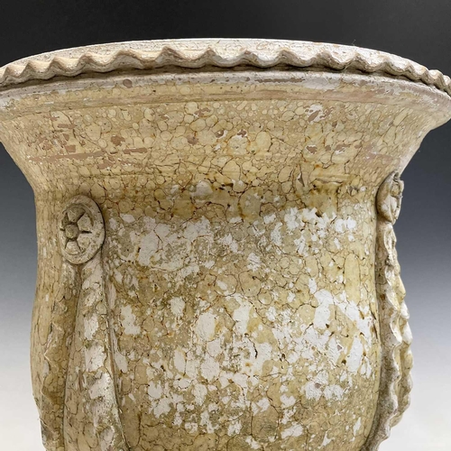 103 - A terracotta urn painted in stone effect, decorated with applied flowers and swags, with a painted p... 