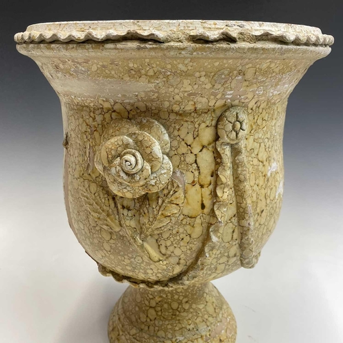 103 - A terracotta urn painted in stone effect, decorated with applied flowers and swags, with a painted p... 