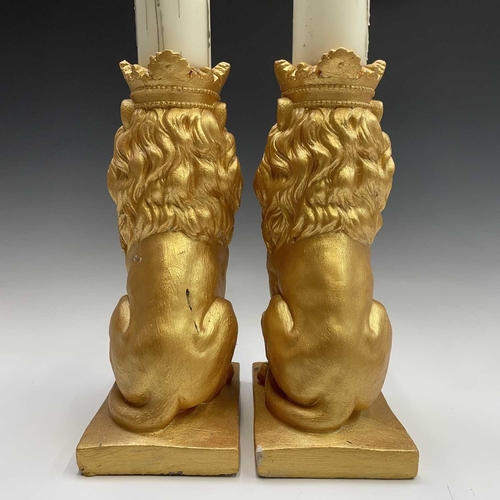 111 - Pair of gold painted lions with candles, height of lions 35cm.