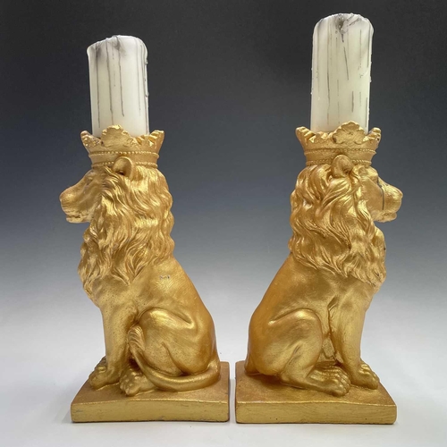 111 - Pair of gold painted lions with candles, height of lions 35cm.