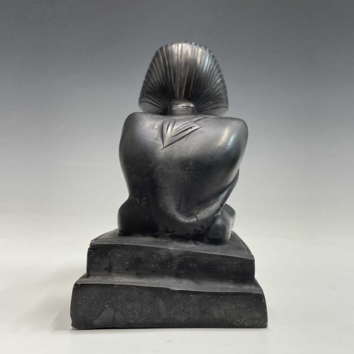 112 - A black onyx carved recumbent lion and a carved black stone sphinx, largest height 18cm width 29cm d... 