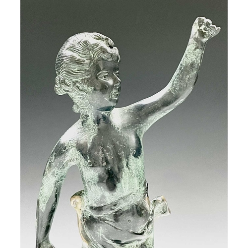 113 - A cast metal figure of putto indistinctly signed to base, height 34cm.