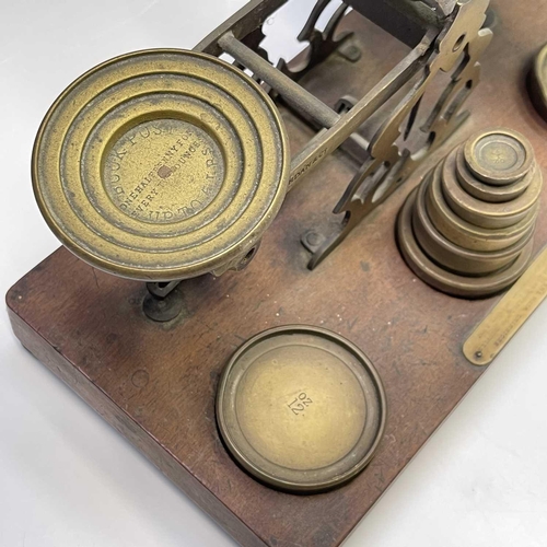 116 - A set of S.Mordan & Co brass parcel scales and weights, circa 1900, with engraved postal rates and a... 