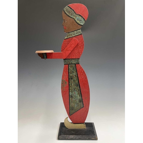 120 - A figural painted wood dumb waiter. Height 77cm.