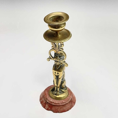 121 - A 19th century cast brass candlestick, the nozzle supported by a panther, height 20.5cm, together wi... 