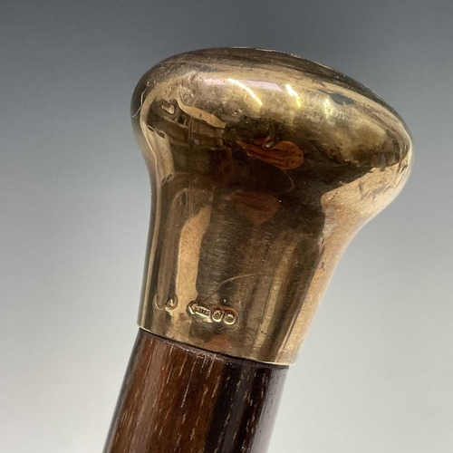 134 - A gentleman's cane, with engraved 9ct gold handle, length 89cm.