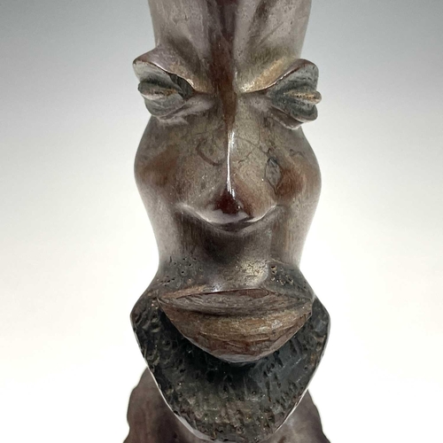 140 - A pair of central African heavy hardwood carved busts, as a male and female, height 38.5cm.