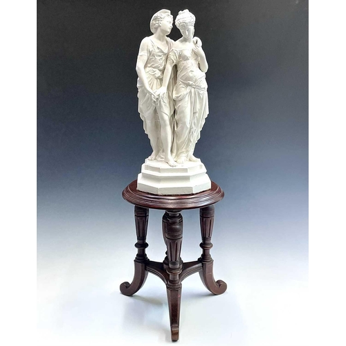 143 - A painted spelter cast group of lovers in the classical style signed Bourel to base, with a tripod s... 