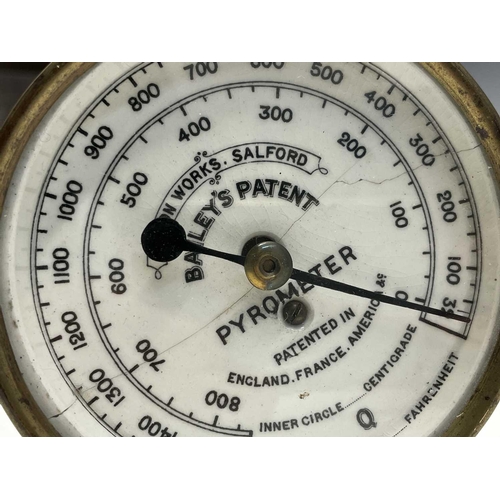 148 - A Bailey's patent brass pyrometer, the enamel dial stamped Albion /works, Salford, length 106cm.