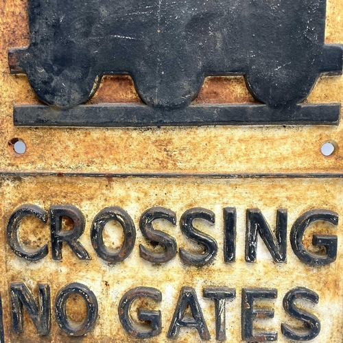 152 - A cast metal sign 'CROSSING NO GATES', 58cm x 29cm.