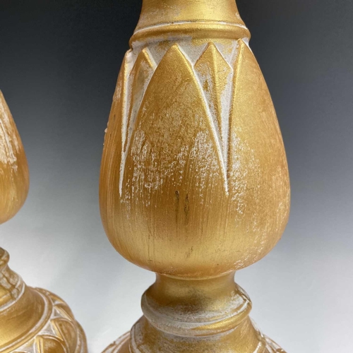 155 - A pair of candleholders decorated with acanthus leaf design, height 63cm.