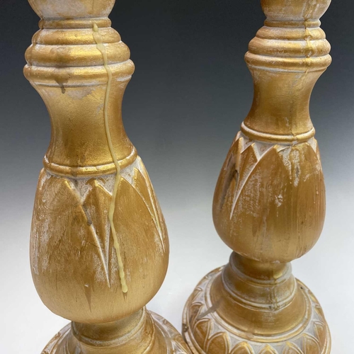 155 - A pair of candleholders decorated with acanthus leaf design, height 63cm.