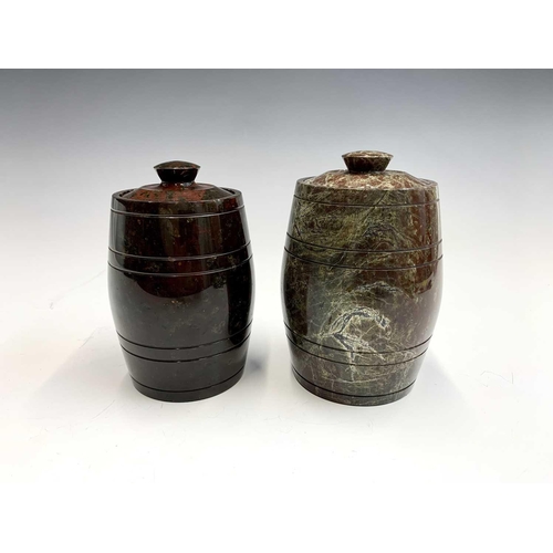 161 - Two cornish serpentine tobacco jars in the form of barrels with lids, largest height 15cm.