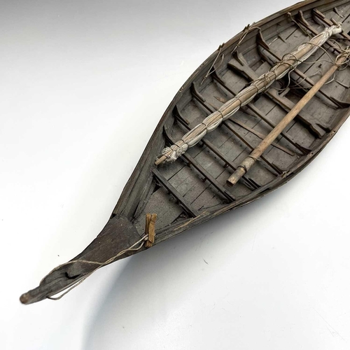 169 - A wood model of a whaleboat, length 67cm width 16cm.