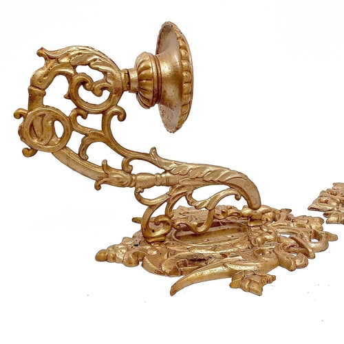 173 - A pair of gold painted cast wall sconces decorated in foliate scrolls, height 60cm width 36cm depth ... 