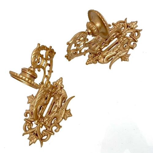 174 - A pair of gold painted cast wall sconces decorated in foliate scrolls, height 60cm width 36cm depth ... 