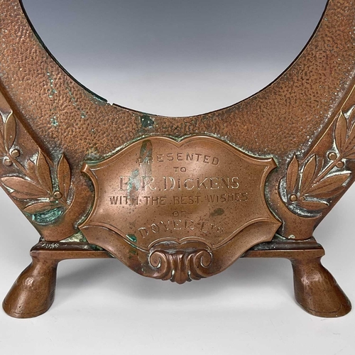 180 - An early 20th century copper frame in the form of an inverted horseshoe decorated with turquoise bea... 