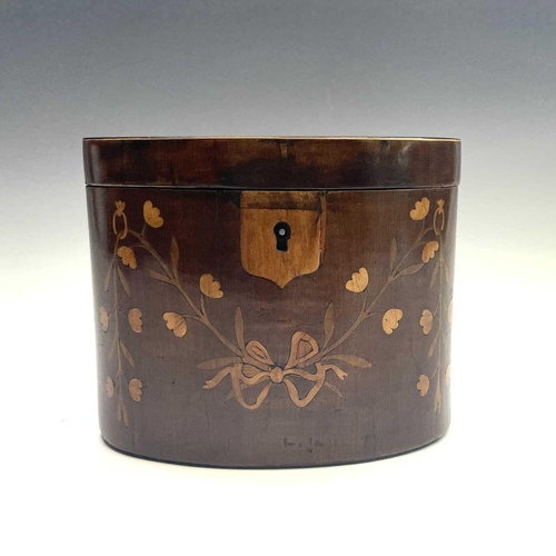 26 - A George III mahogany oval tea caddy, with floral inlaid ribbon tied decoration, width 14.5cm.