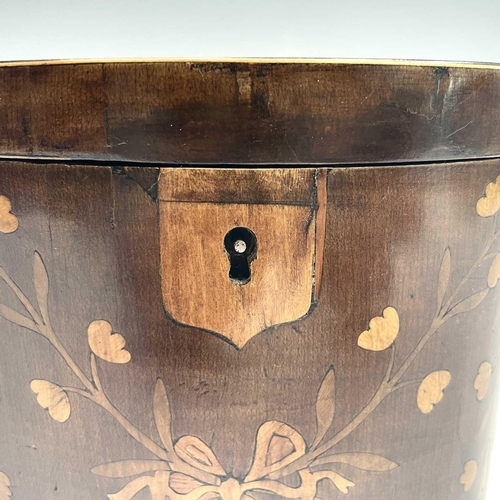 26 - A George III mahogany oval tea caddy, with floral inlaid ribbon tied decoration, width 14.5cm.