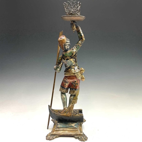 3 - A Venetian blackamoor gondolier figure, circa 1900, with painted and gilt decoration, modelled stand... 