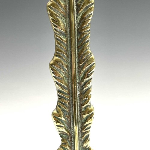 317 - A Victorian brass lion's paw doorstop, height 37cm.