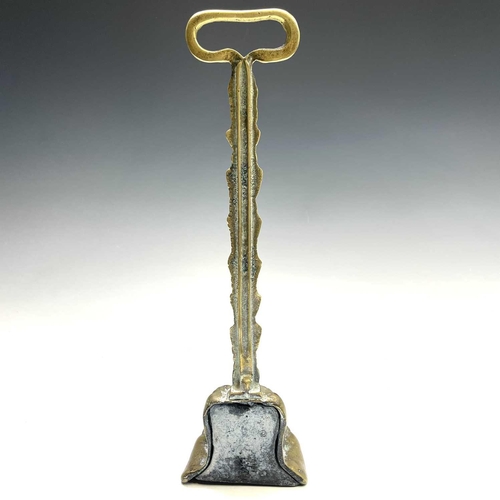 317 - A Victorian brass lion's paw doorstop, height 37cm.