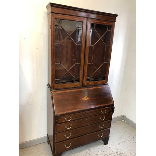 3201 - An Edwardian mahogany and satinwood banded bureau bookcase, with glazed upper section, the lower par... 