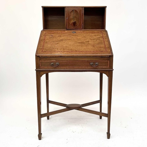 3204 - A 20th century mahogany crossbanded bureau the fall front enclosing a fitted interior above a single... 