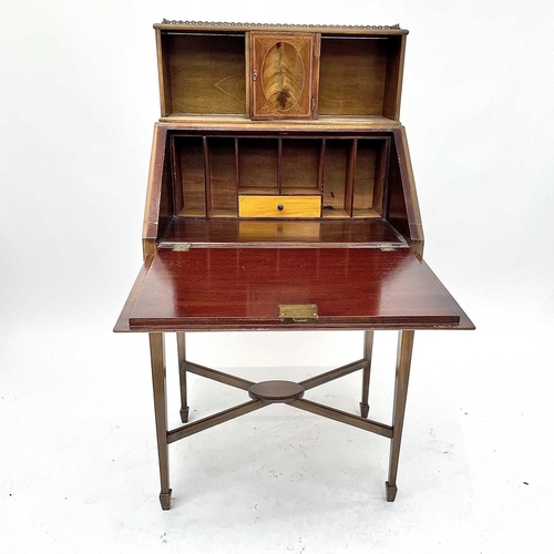 3204 - A 20th century mahogany crossbanded bureau the fall front enclosing a fitted interior above a single... 