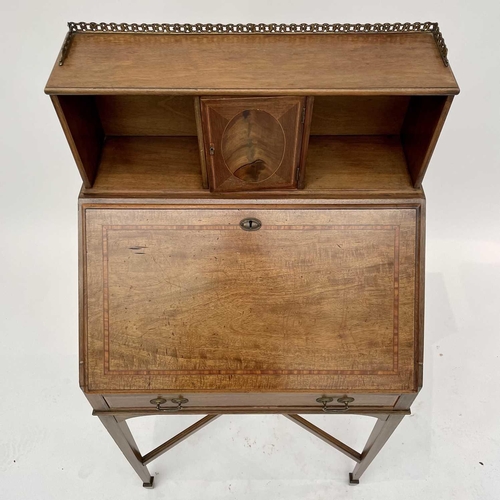 3204 - A 20th century mahogany crossbanded bureau the fall front enclosing a fitted interior above a single... 