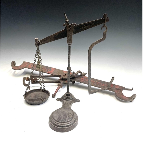 324 - A cast iron Toweich 4lb class 4 scales and a cast iron balance scales Bartlett & Son LTD Bristol.