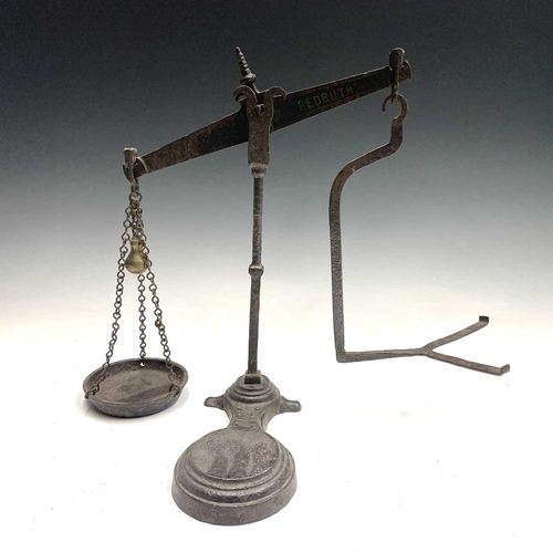 324 - A cast iron Toweich 4lb class 4 scales and a cast iron balance scales Bartlett & Son LTD Bristol.