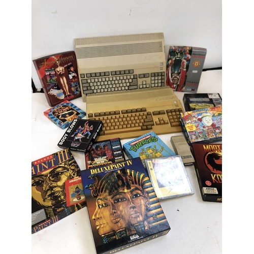 351 - Two AMIGA A500s, an AMIGA A520 mod, various games, paint and animation software, manuals and accesso... 