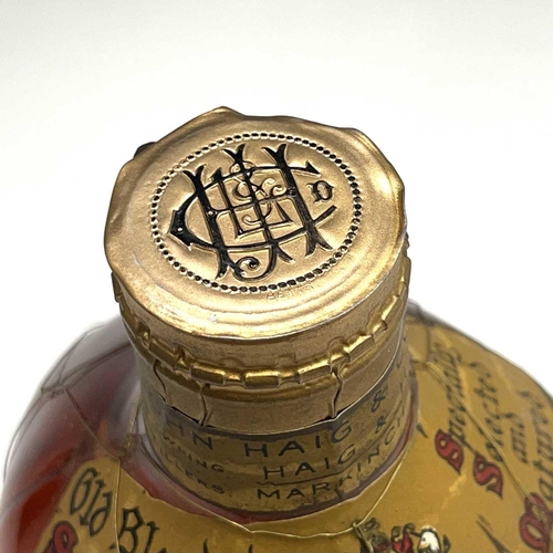 353 - Haig's Dimple Scotch whisky circa 1950 in presentation box together with a smaller bottle and a mini... 