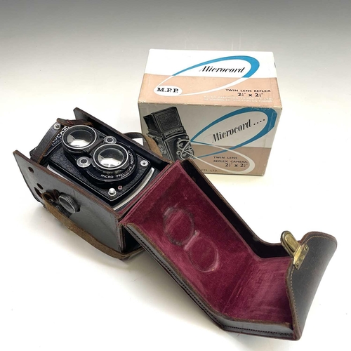 354 - Microcord Twin Reflex camera in leather case with original box.