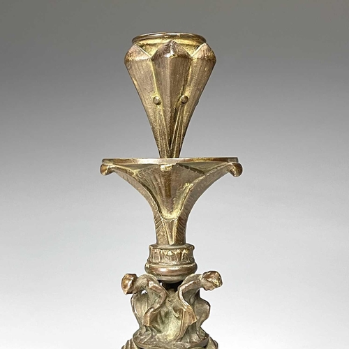 36 - A pair of late 19th century bronze ecclesiastical gothic candlesticks, the bases modelled with three... 