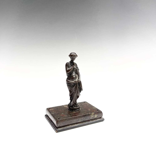 37 - A bronze figure of a Classical maiden, late 19th century, on a Cornish serpentine rectangular base, ... 