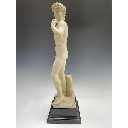 40 - A composite marble statue of Michelangelo's David on a marble base by G Ruggeri signed, height 72cm.