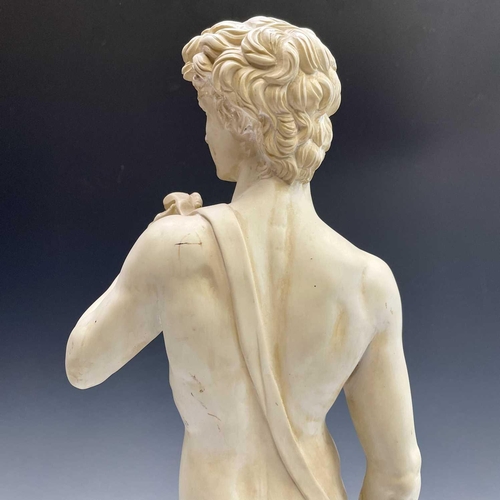 40 - A composite marble statue of Michelangelo's David on a marble base by G Ruggeri signed, height 72cm.