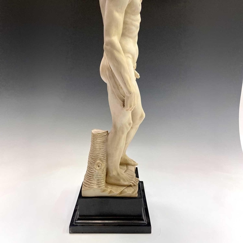 40 - A composite marble statue of Michelangelo's David on a marble base by G Ruggeri signed, height 72cm.