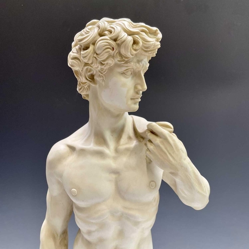 40 - A composite marble statue of Michelangelo's David on a marble base by G Ruggeri signed, height 72cm.