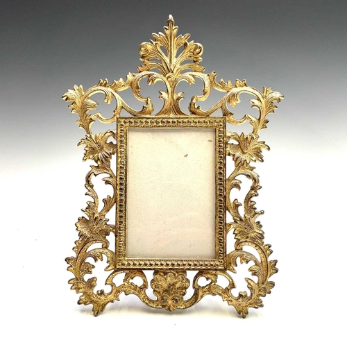 42 - Three 19th century French cast brass gilded photo frames decorated in rococo style, height 31cm.