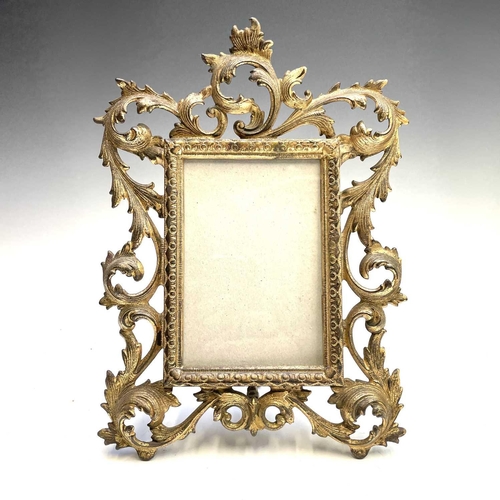 42 - Three 19th century French cast brass gilded photo frames decorated in rococo style, height 31cm.