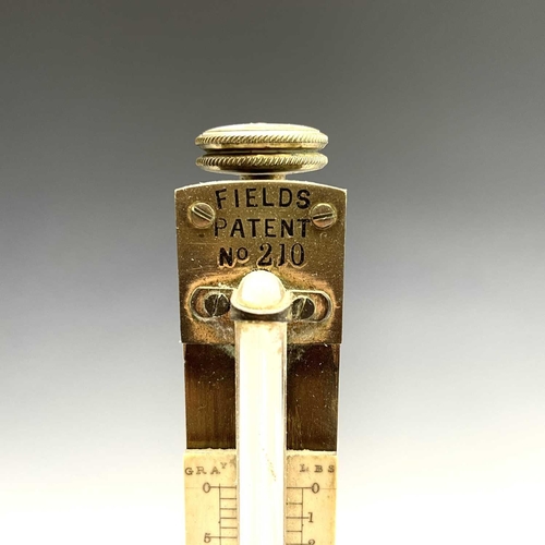 43 - A Field's patent brass hydrometer, with adjustable scale and fitted base, height 40cm, together with... 