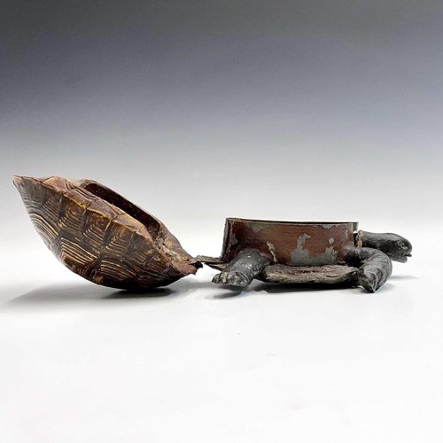 53 - A box and cover, in the form of a tortoise, circa 1920, with natural shell cover and composition hea... 