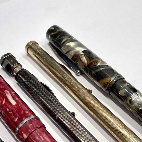 54 - A Watermans fountain pen, three others, a silver Yard-o-led pencil and two others (7).